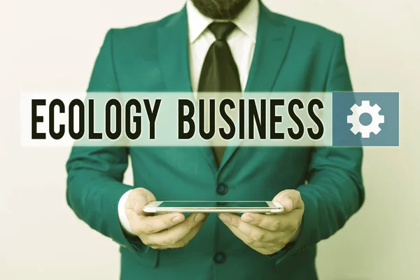 Text sign showing Ecology Business. Conceptual photo global ecology and environment protection business Businessman in blue suite with a tie holds lap top in hands. — Stockfoto