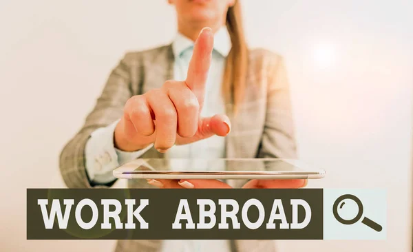 Writing note showing Work Abroad. Business photo showcasing Getting a job or working in a foreign geographical area Digital business concept with business woman. — Stok fotoğraf