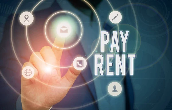 Conceptual hand writing showing Pay Rent. Business photo text To pay money in exchange for the use of someone else s is property.