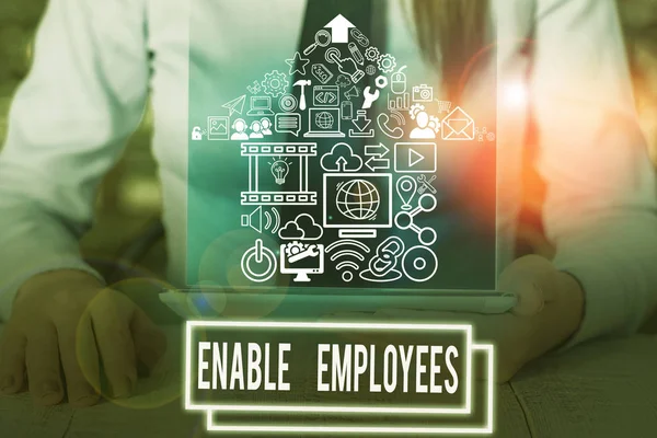 stock image Writing note showing Enable Employees. Business photo showcasing giving employees with the information they need to succeed.