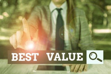 Text sign showing Best Value. Conceptual photo most advantageous combination of cost and quality of a product Female business person sitting by table holding mobile phone.
