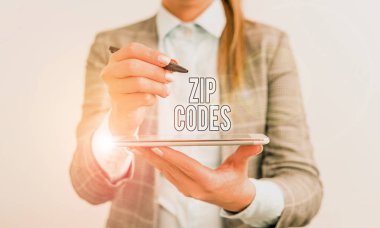 Handwriting text Zip Codes. Concept meaning numbers added to a postal address to assist the sorting of mail Business concept with mobile phone and business woman.
