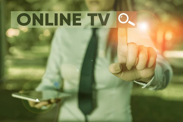 Word writing text Online Tv. Business concept for a television production broadcast in realtime as events happen Handsome business girl pointing with finger into empty space. — Stock Photo, Image