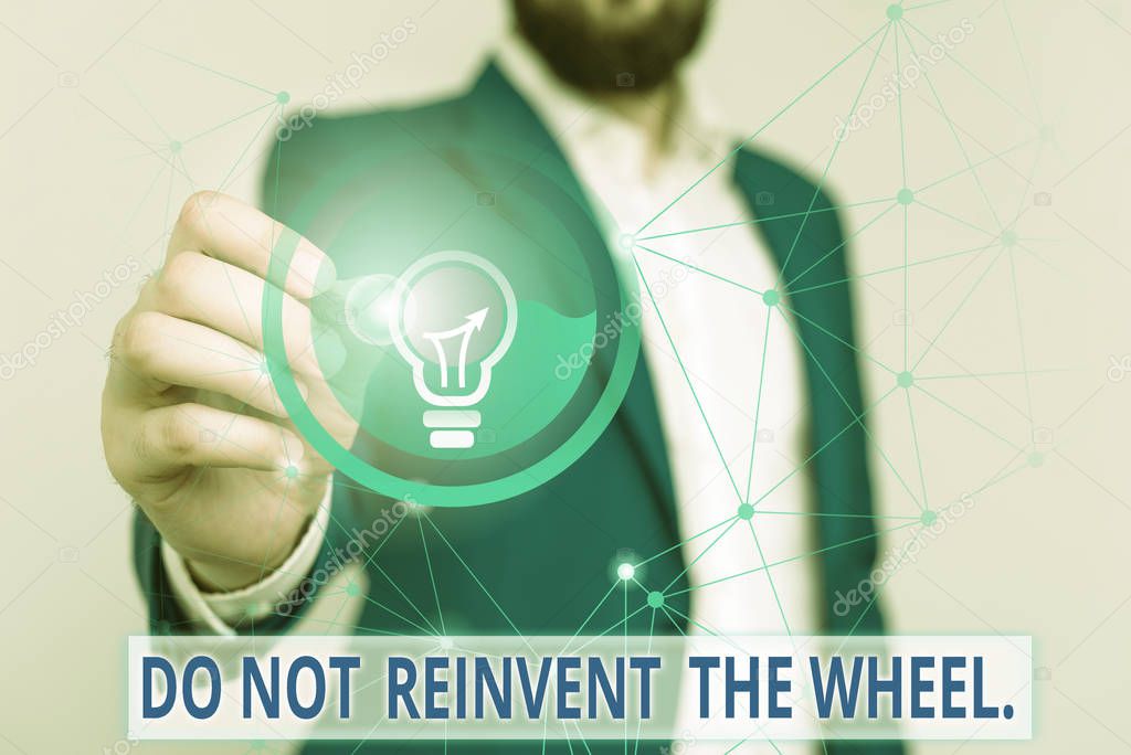 Text sign showing Do Not Reinvent The Wheel. Conceptual photo stop duplicating a basic method previously done Male human wear formal work suit presenting presentation using smart device.