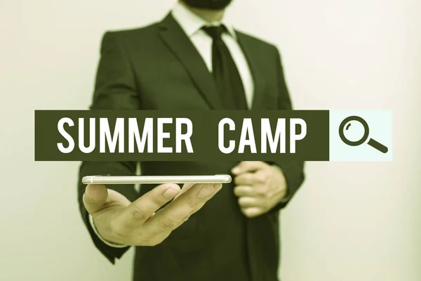 Handwriting text Summer Camp. Concept meaning supervised program for children conducted during the summer Male human wear formal work suit hold smart hi tech smartphone use one hand. — Stockfoto