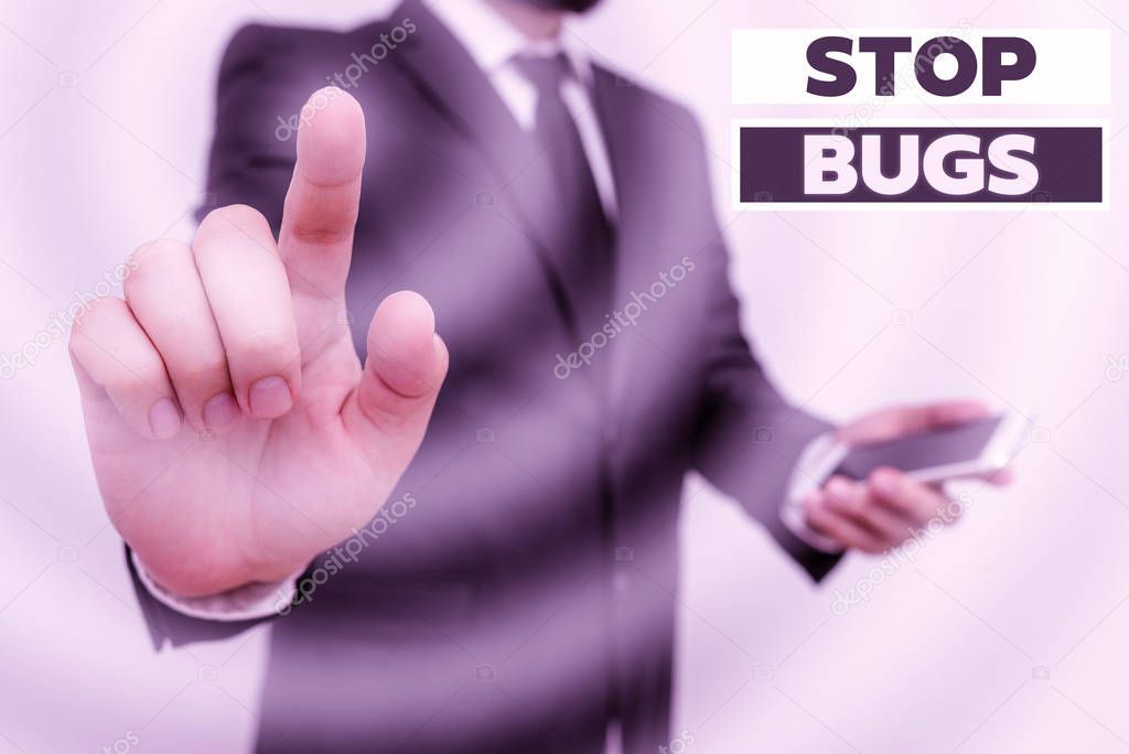 Word writing text Stop Bugs. Business concept for Get rid an insect or similar small creature that sucks blood Male human wear formal work suit hold smart hi tech smartphone use one hand.