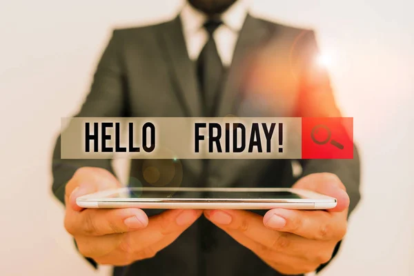 Text sign showing Hello Friday. Conceptual photo you say this for wishing and hoping another good lovely week Male human wear formal work suit hold smart hi tech smartphone use hands.