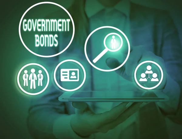 Writing note showing Government Bonds. Business photo showcasing debt security issued by a government to support spending. — Stockfoto