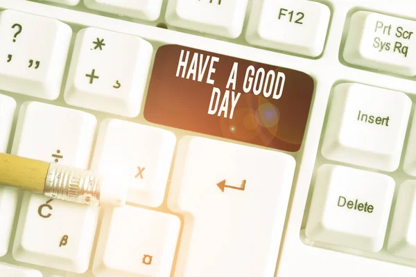Text sign showing Have A Good Day. Conceptual photo Nice gesture positive wishes Greeting Enjoy Be happy White pc keyboard with empty note paper above white background key copy space.