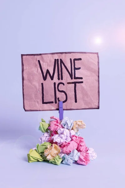 Word writing text Wine List. Business concept for menu of wine selections for purchase typically in a restaurant Reminder pile colored crumpled paper clothespin reminder blue background. — Stock Photo, Image