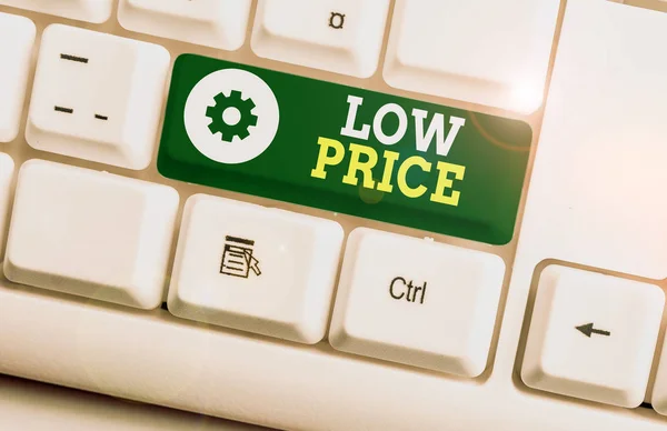 Writing note showing Low Price. Business photo showcasing Price are the lowest in relation to other things of same kind White pc keyboard with note paper above the white background.