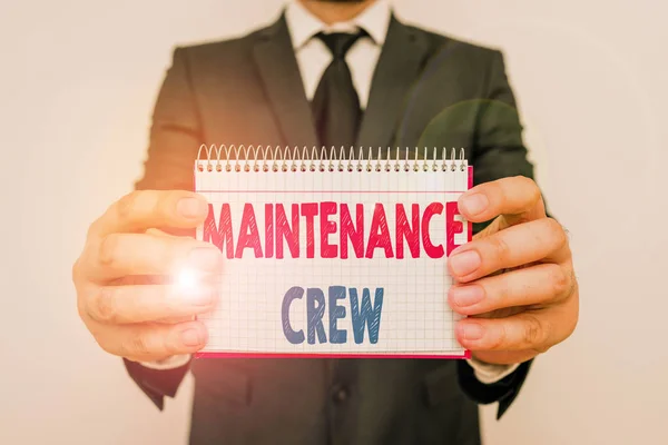 Writing note showing Maintenance Crew. Business photo showcasing responsible for maintenance and repair work of buildings Male human wear formal work suit with office look hold book.