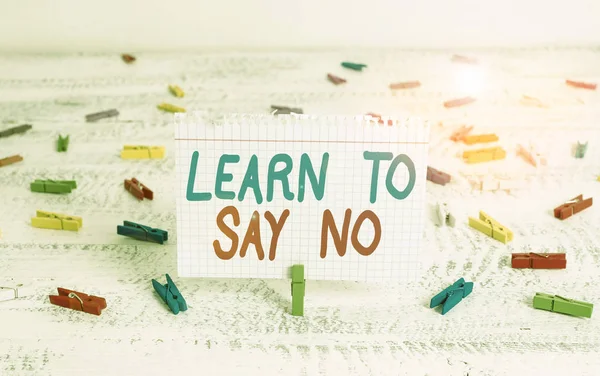 Handwriting text writing Learn To Say No. Concept meaning dont hesitate tell that you dont or want doing something Green clothespin white wood background colored paper reminder office supply. — Stock Photo, Image