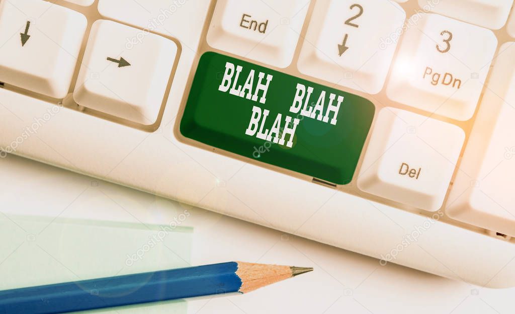 Text sign showing Blah Blah Blah. Conceptual photo Talking too much false information gossips nonsense speaking White pc keyboard with empty note paper above white background key copy space.