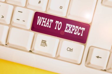Word writing text What To Expect. Business concept for Confusion about the belief of what will happen in future White pc keyboard with empty note paper above white background key copy space.