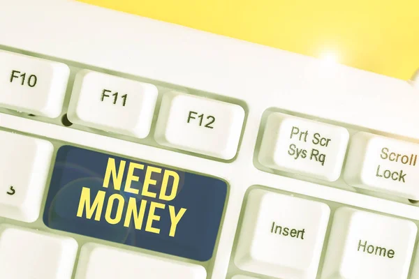 Text sign showing Need Money. Conceptual photo require a financial assistance to sustain spending or endeavor White pc keyboard with empty note paper above white background key copy space. — Stock Photo, Image
