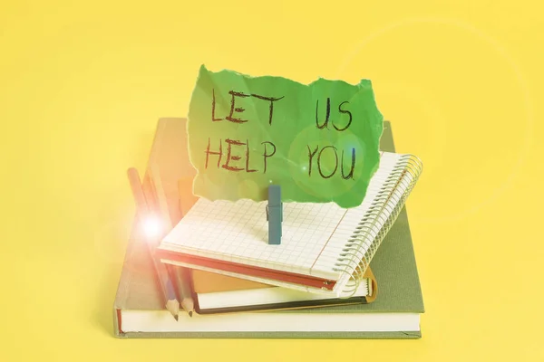 Text sign showing Let Us Help You. Conceptual photo Offering a service to someone to help him in his necessity Book pencil rectangle shaped reminder notebook clothespin office supplies. — ストック写真
