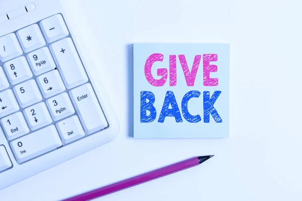 Handwriting text Give Back. Concept meaning the act of giving someone something that they owned or had before White pc keyboard with empty note paper and pencil above white background.