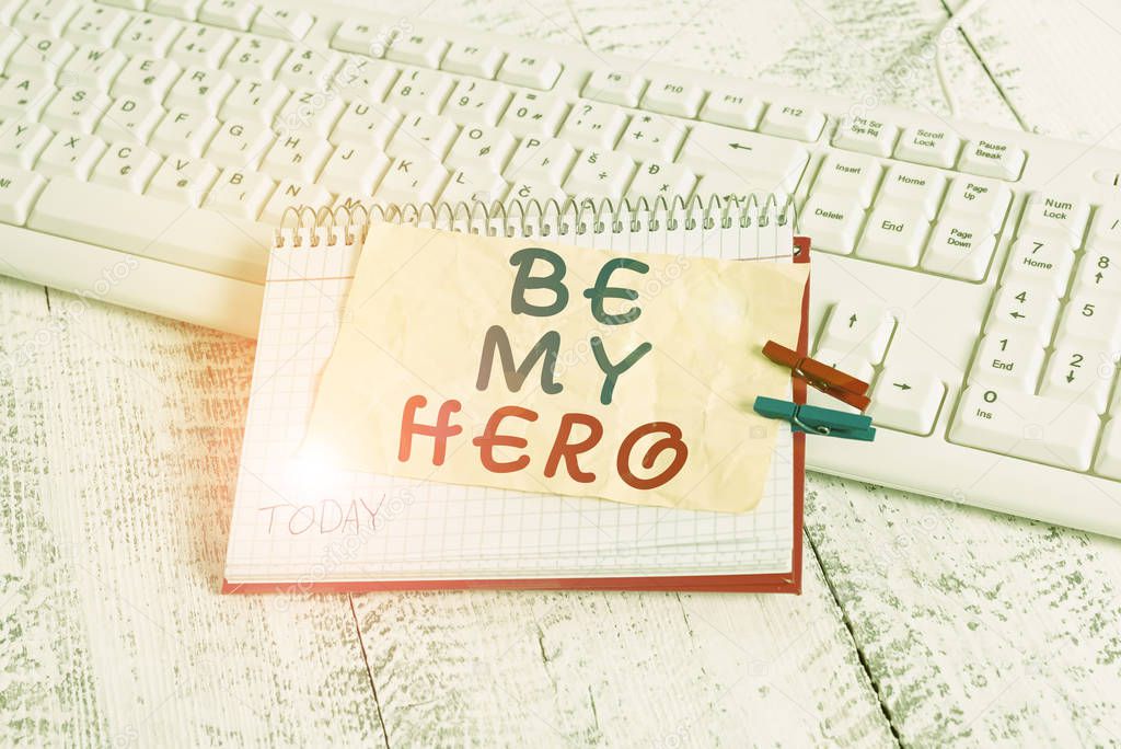Conceptual hand writing showing Be My Hero. Business photo text Request by someone to get some efforts of heroic actions for him notebook reminder clothespin with pinned sheet light wooden.