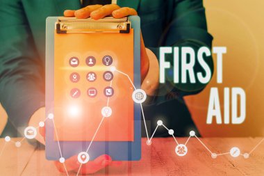 İlk Yardım'ı gösteren bir not yazıyorum. İş fotoğraf tıbbi eğitim için gerek yok küçük kesikler şifa Pratik vitrine.