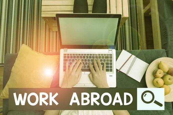 Text sign showing Work Abroad. Conceptual photo Getting a job or working in a foreign geographical area woman laptop computer office supplies technological devices inside home.