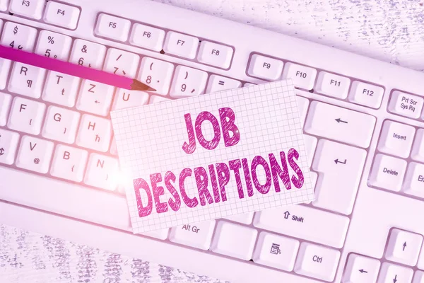 Word writing text Job Descriptions. Business concept for a formal account of an employee s is responsibilities White keyboard office supplies empty rectangle shaped paper reminder wood. — Stock Photo, Image