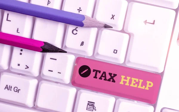 Handwriting text writing Tax Help. Concept meaning Assistance from the compulsory contribution to the state revenue White pc keyboard with empty note paper above white background key copy space. — Stock Photo, Image