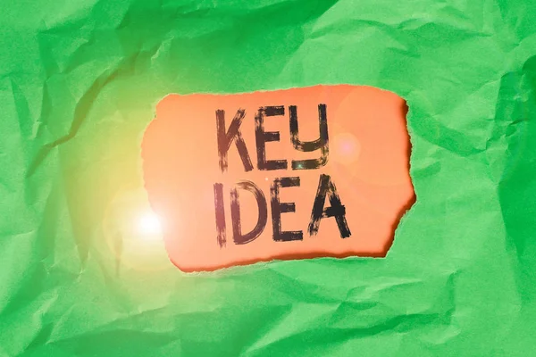 Handwriting text Key Idea. Concept meaning Exceptional or vital thought or suggestion Without comparison Green crumpled ripped colored paper sheet centre torn colorful background. — Stock Photo, Image