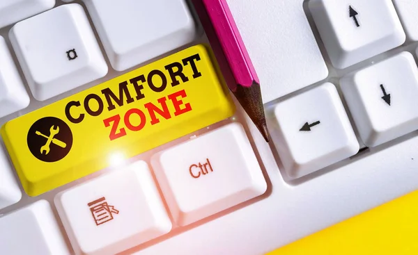 Handwriting text Comfort Zone. Concept meaning place or situation where one feels safe and without stress White pc keyboard with empty note paper above white background key copy space.