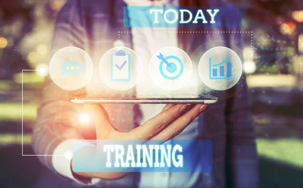 Text sign showing Training. Conceptual photo An activity occurred when starting a new job project or work Female human wear formal work suit presenting presentation use smart device. — Stock Photo, Image