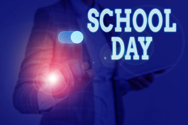 Writing note showing School Day. Business photo showcasing starts from seven or eight am to three pm get taught there Woman wear formal work suit presenting presentation using smart device.