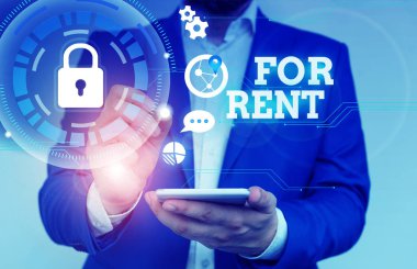 Writing note showing For Rent. Business photo showcasing when you make property available for purchasing temporarily Male human wear formal suit presenting using smart device.