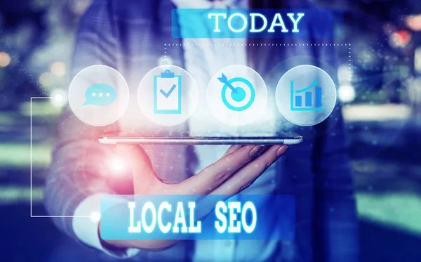 Text sign showing Local Seo. Conceptual photo This is an effective way of marketing your business online Female human wear formal work suit presenting presentation use smart device. — Stock Photo, Image