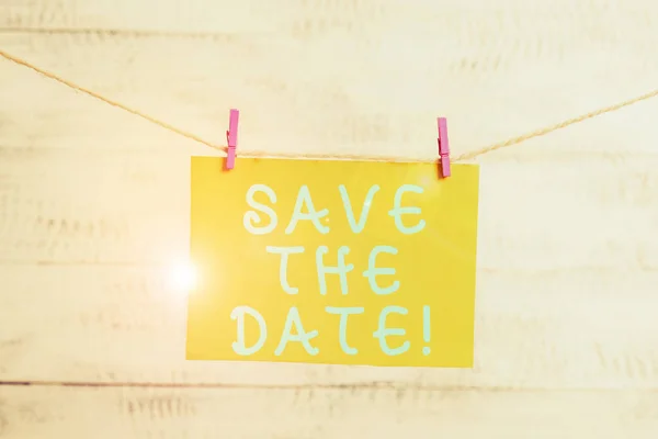 Conceptual hand writing showing Save The Date. Business photo text Organizing events well make day special event organizers Clothespin rectangle shaped paper reminder white wood desk. — Stock Photo, Image