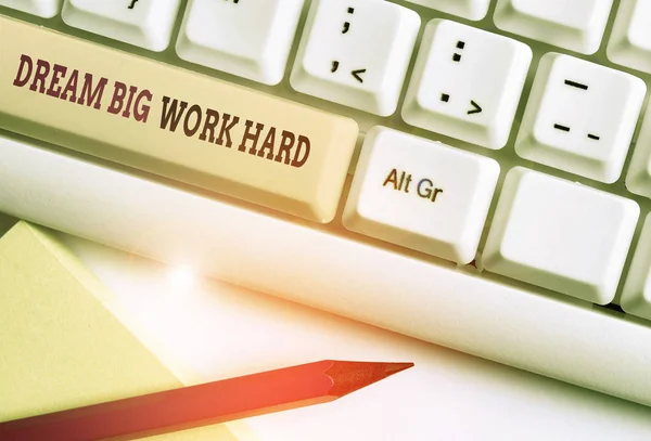 Word writing text Dream Big Work Hard. Business concept for Believe in yourself and follow the dreams and goals White pc keyboard with empty note paper above white background key copy space.