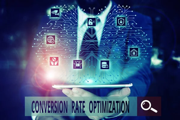 Conceptual hand writing showing Conversion Rate Optimization. Business photo text system for increasing percentage of visitors Male wear formal work suit presenting presentation smart device.