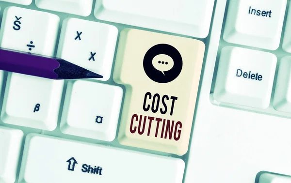 Writing note showing Cost Cutting. Business photo showcasing actions taken to reduce the amount that is spent on a service White pc keyboard with note paper above the white background. — Stock fotografie