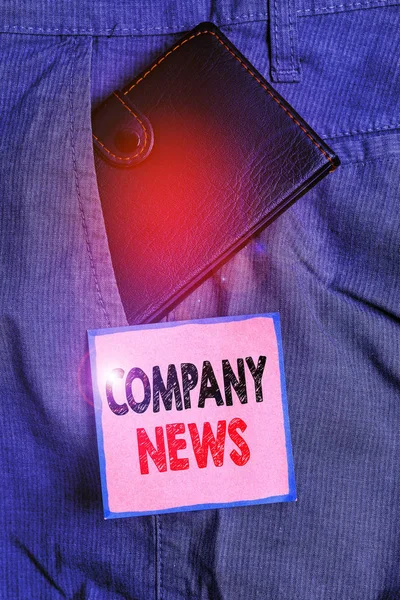 Handwriting text writing Company News. Concept meaning provides news and feature articles about the company status Small little wallet inside man trousers front pocket near notation paper.