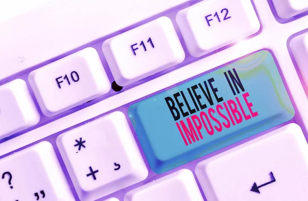 Text sign showing Believe In Impossible. Conceptual photo You can do it everything is possible Work hard White pc keyboard with empty note paper above white background key copy space. — Stockfoto