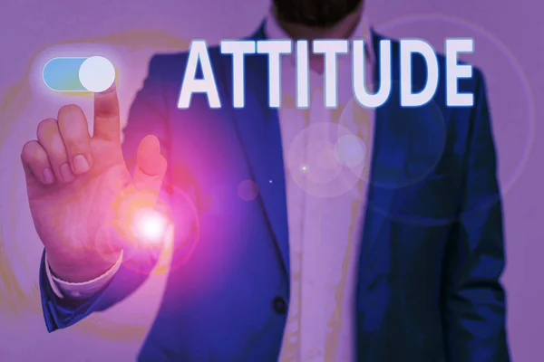 Conceptual hand writing showing Attitude. Business photo showcasing settled way of thinking or feeling about something Personality Male wear formal suit presenting presentation smart device.