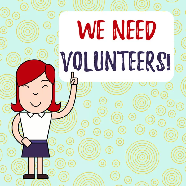 Text sign showing We Need Volunteers. Conceptual photo someone who does work without being paid for it Woman Standing with Raised Left Index Finger Pointing at Blank Text Box. — Stock Photo, Image