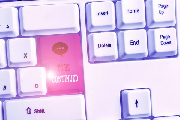Text sign showing To Be Continued. Conceptual photo indicate that the story continues in the next episode White pc keyboard with empty note paper above white background key copy space.