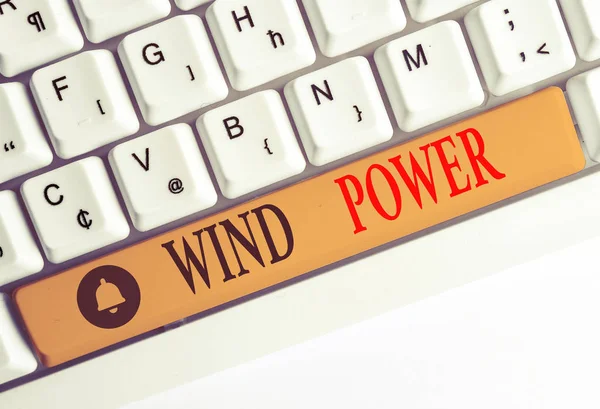 Word writing text Wind Power. Business concept for use of air flowto provide mechanical power to turn generators White pc keyboard with empty note paper above white background key copy space.