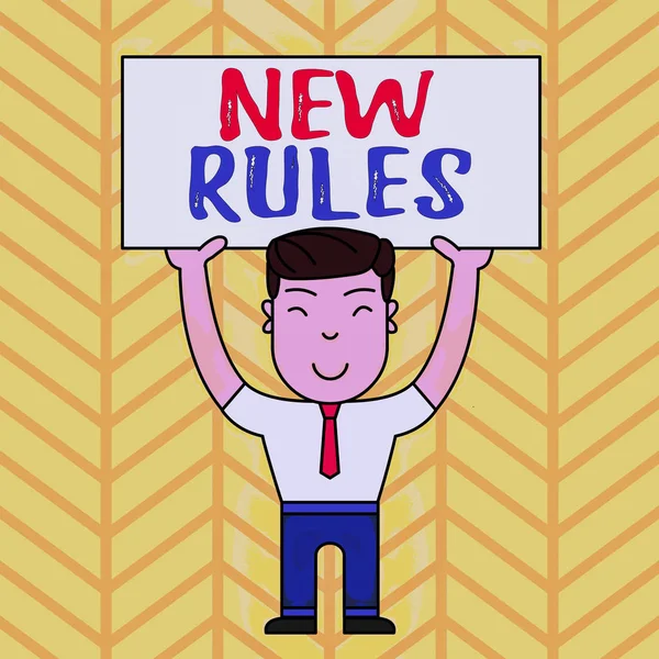 Text sign showing New Rules. Conceptual photo A state of changing an iplemented policy for better upgrade Smiling Man Standing Holding Big Empty Placard Overhead with Both Hands.