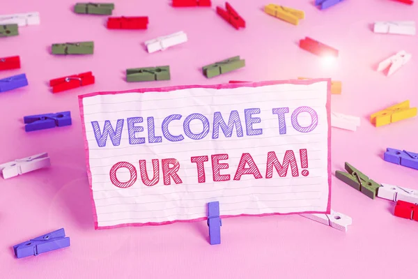 Text sign showing Welcome To Our Team. Conceptual photo introducing another demonstrating to your team mates Colored clothespin papers empty reminder pink floor background office pin. — Stock Photo, Image
