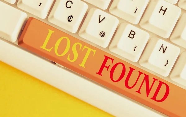 Conceptual hand writing showing Lost Found. Business photo showcasing Things that are left behind and may retrieve to the owner White pc keyboard with note paper above the white background. — 图库照片