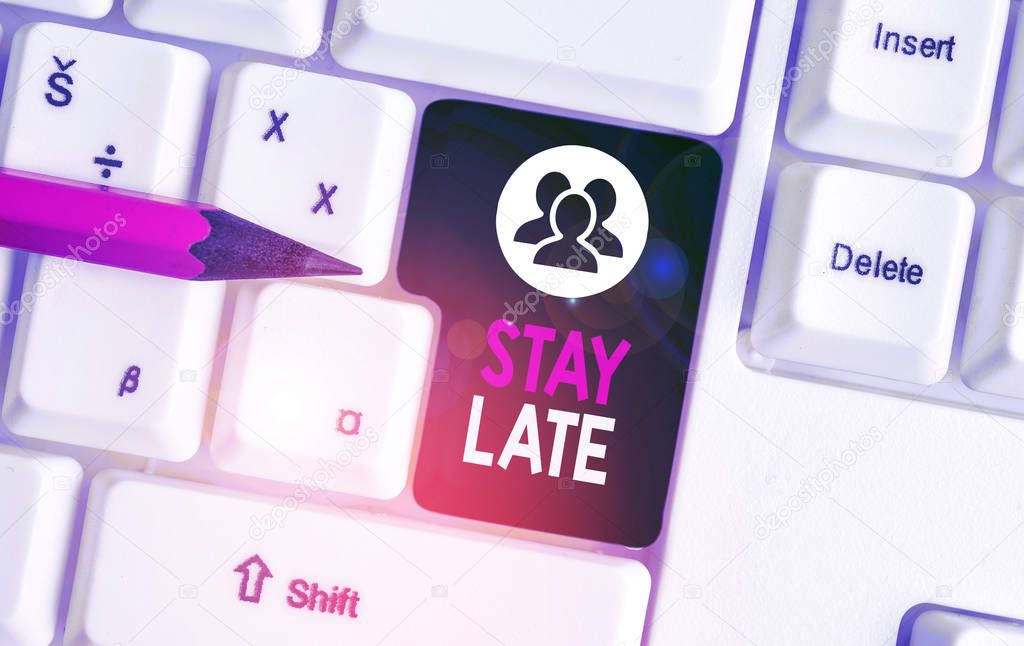 Text sign showing Stay Late. Conceptual photo A routine in which a demonstrating goes to somewhere out of time White pc keyboard with empty note paper above white background key copy space.
