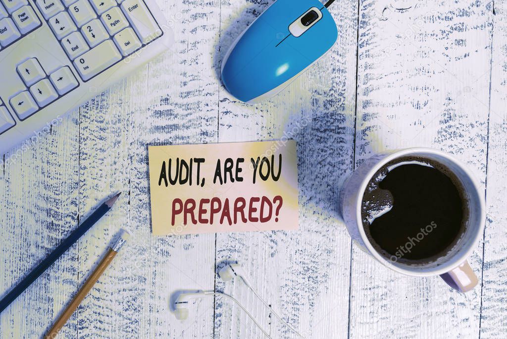 Conceptual hand writing showing Audit Are You Prepared Question. Business photo text asking if he is ready to do something Technological devices colored reminder paper office supplies.