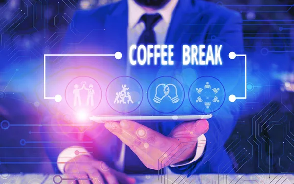Writing note showing Coffee Break. Business photo showcasing short time when you stop working to have a cup of coffee Male wear formal work suit presenting presentation smart device. — ストック写真