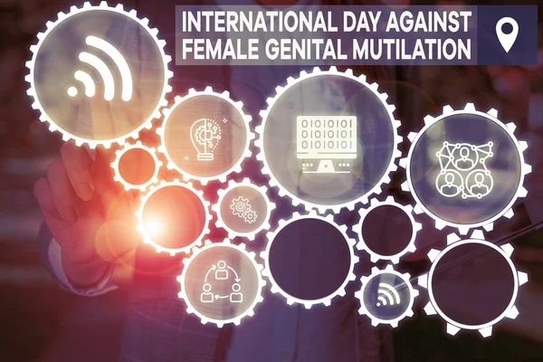 Word writing text International Day Against. Business concept for International Day Against Female Genital Mutilation Woman wear formal work suit presenting presentation using smart device.